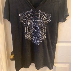 selling a black Affliction shirt